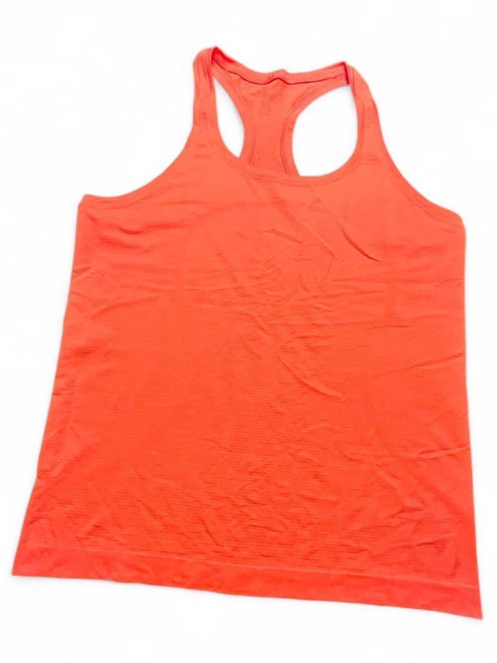 Lululemon coral tank top with encouraging message on hem, 12
